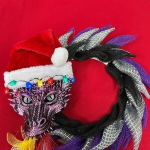 Santa dragon! Lights on Santa hat, light up as well as flames from the mouth